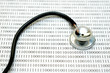 stethoscope and binary code