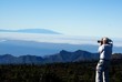 photographer toward islands and clouds