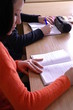 a student writing in the classroom