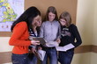 a group of students discussing their work