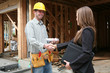 Photo: woman shaking hands with construction man woman shaking hands with construction man