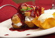 Photo: tasty profiteroles on a dining table tasty profiteroles on a dining table