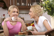 smiling girls have tea