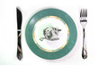 dollars as meal on a plate on white