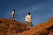 kids hiking on red rock