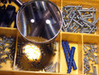 a set of screws under a magnifier