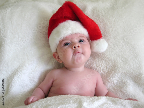 funny baby face in santa hat