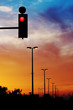 red traffic light and dramatic sky