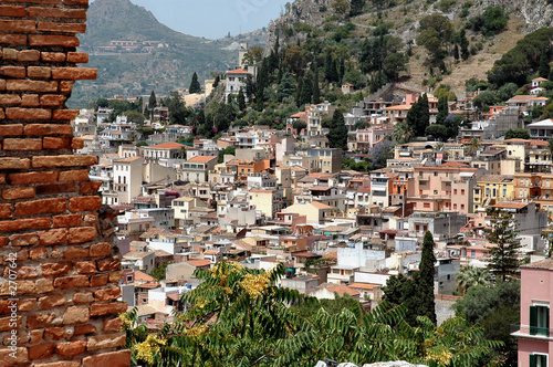 taormina, sicily with mountain in background taormina, sicily with mountain in background