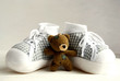 teddy bear and baby's shoes
