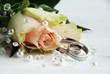 wedding rings and rose