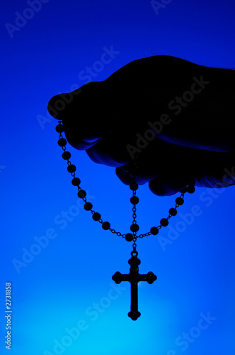 hand holding rosary hand holding rosary