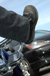 vertical shot of a biker stuck in traffic