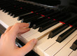 fingers on piano keys