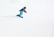 a girl riding fast on the snowboard