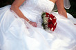 bride with red rose bouquet