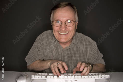 Photo: happy man viewing computer happy man viewing computer