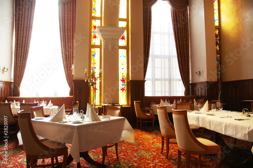 restaurant with served tables ready for customers