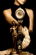 sepia picture of a clock and beautiful young girl (focus on cloc