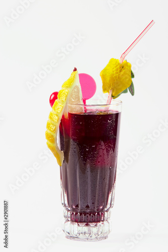 Photo: dark drink with citron and cherry on white backgro dark drink with citron and cherry on white backgro