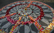 "imagine" monument with flowers in peace sign