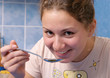 smiling girl is eating