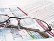 newspaper with eye glassess