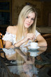 the woman drink coffee at restaurant.