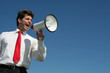 businessman shouting through megaphone businessman shouting through megaphone