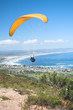 paraglider ridge soaring next to the mountain