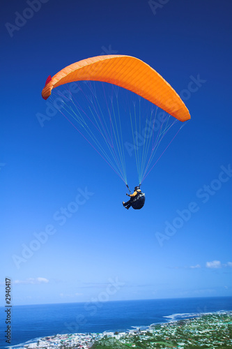 Photo: paraglider launching from the mountain ridge paraglider launching from the mountain ridge