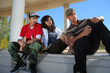 3 teens having fun looking at cell phone