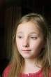 young girl deep in thought.