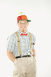 young man dressed like nerd with hands in pockets.