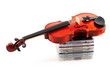 violin lying down on cds on white background