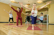 adult females in yoga class.