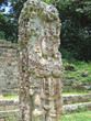 maya deus stone statue with some coloured paint, copan, honduras