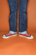 person in jeans and sneakers