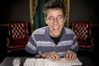 Foto: happy teenage boy on computer happy teenage boy on computer