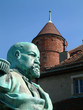 statue and a castle in switzerland statue and a castle in switzerland
