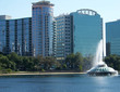 building by lake with fountain building by lake with fountain