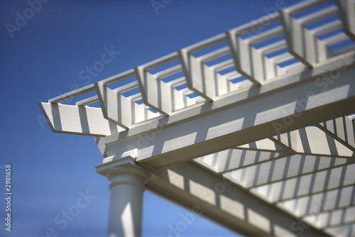 White trelliswork over outside deck.