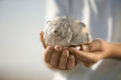 Boy holding seashell.