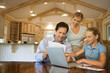Photo: Family paying bills on computer. Family paying bills on computer.