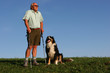 men and dog