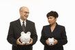 Photo: businesspeople holding piggybanks. businesspeople holding piggybanks.