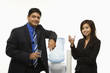 businessman and businesswoman at water cooler.