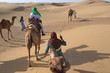 riding camels in the dunes, jaisalmer desert, india
