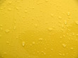 backgrounds: textural: wet yellow painted metal