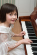 girl playing piano